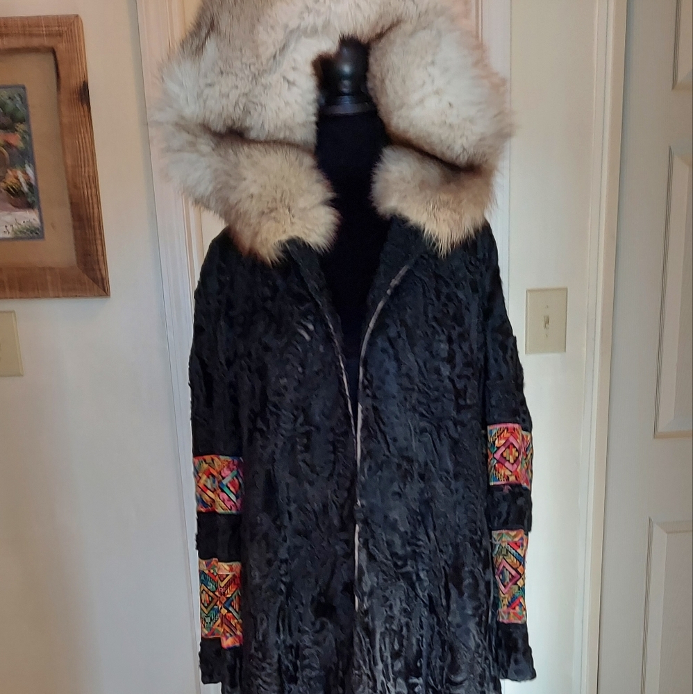 Broadtail full length coat with embroidery detailing.